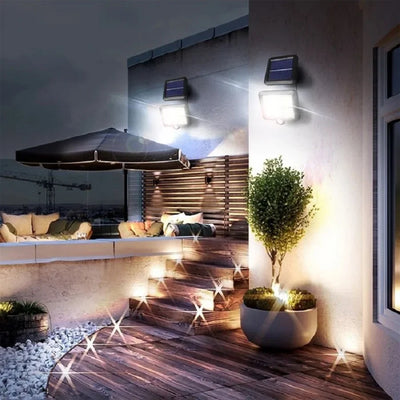 Outdoor terrace with RadiantGrid TriMode Pro solar wall light illuminating steps and seating area, showcasing versatile and efficient outdoor lighting.