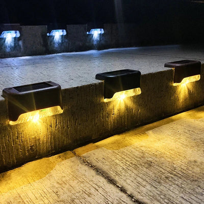 Waterproof RadiantGrid Solar Step Lights illuminating outdoor stairs with motion sensor functionality.